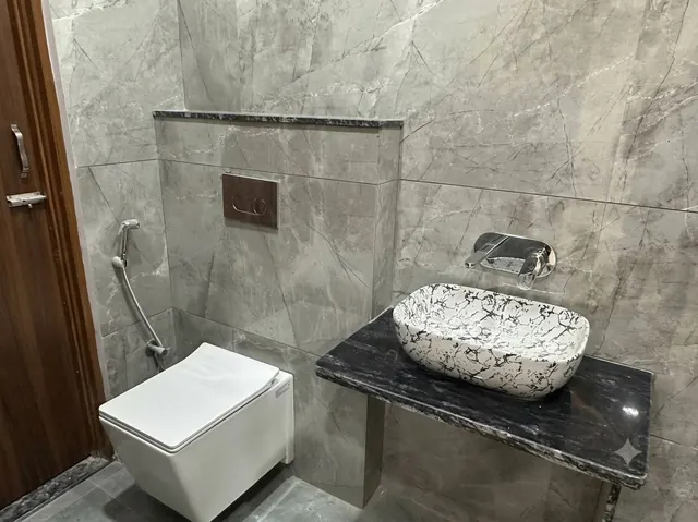 Bathroom with Jaquar fittings and decorative washbasin